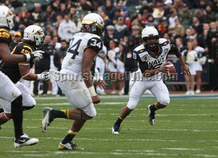 122912 Kraft SA-035.JPG - Dec 29, 2012; San Francisco, CA, USA; Navy Midshipmen quarterback Keenan Reynolds is flushed from the pocket against the Arizona State Sun Devils in the 2012 Kraft Fighting Hunger Bowl at AT&T Park.